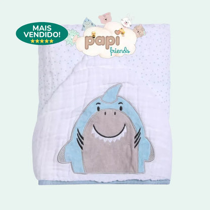 Toalha de banho bebe dobrada com estampa de tubarão lúdico e selo de produto "Mais Vendido"