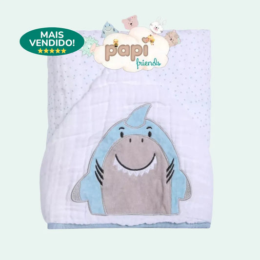 Toalha de banho bebe dobrada com estampa de tubarão lúdico e selo de produto "Mais Vendido"